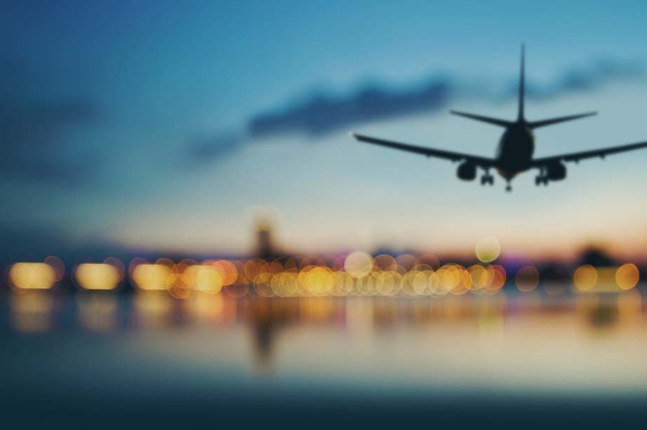 Airplane arriving sunset