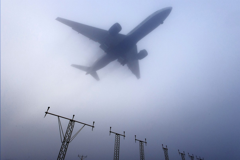 British Airways plane flying in fog sky