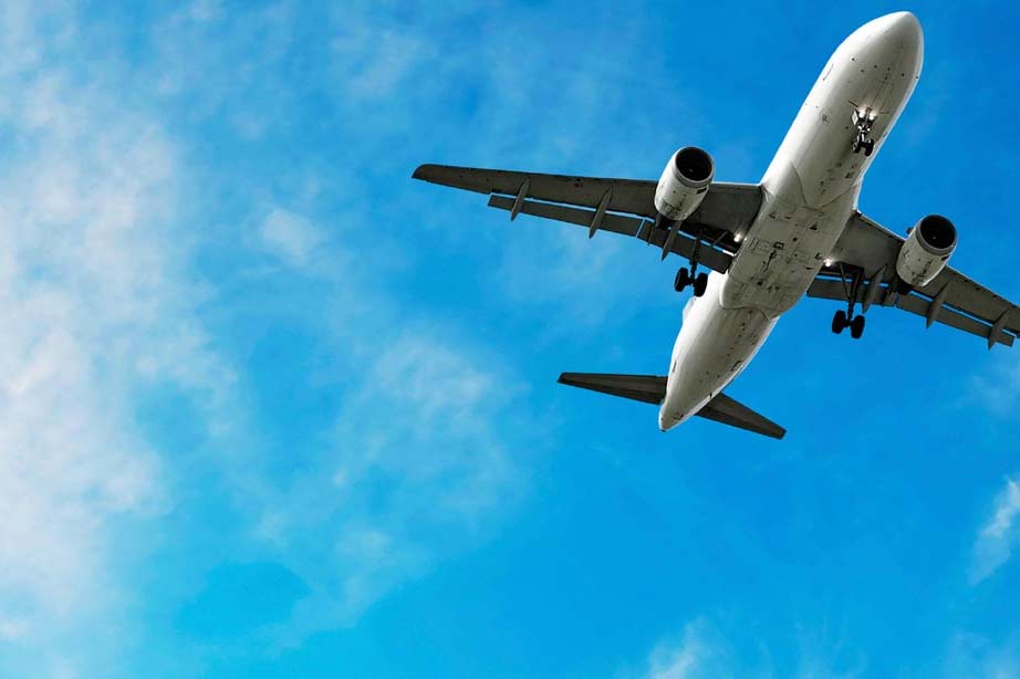 Airplane flying in blue sky