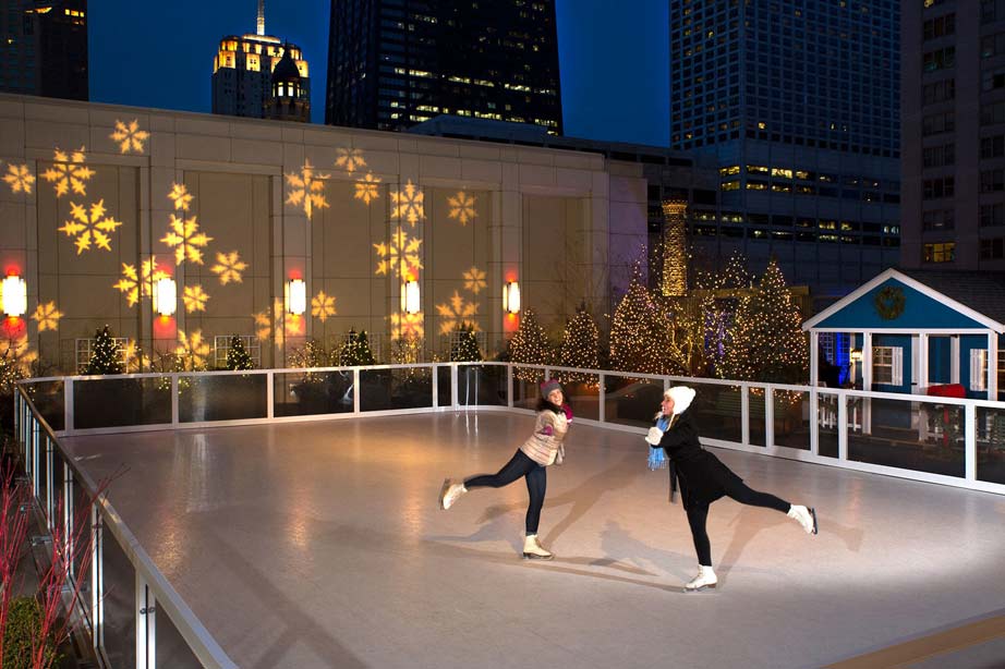 two girls ice skating in dark