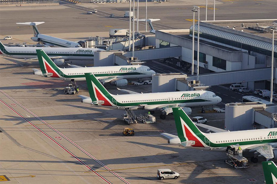 alitalia airplanes at gate at rome airport