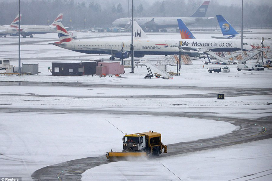 flights stranded at airport covered in snow