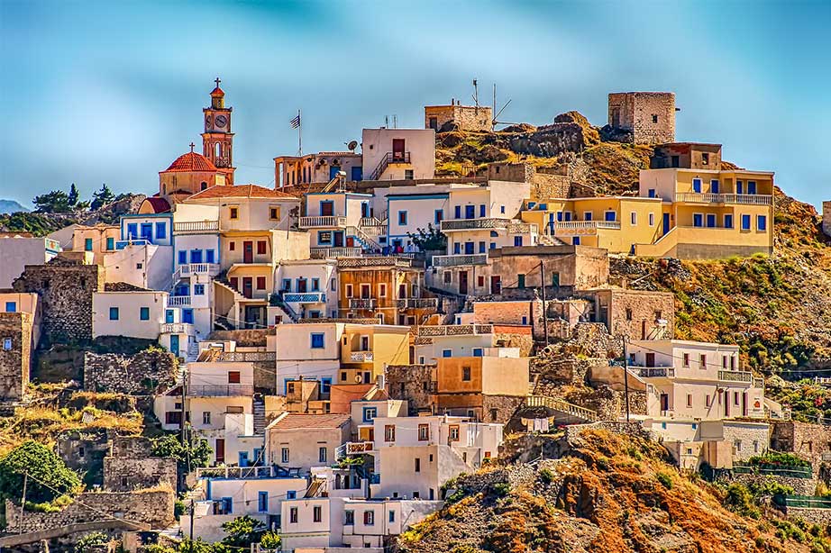 houses on a greek island with blue sky