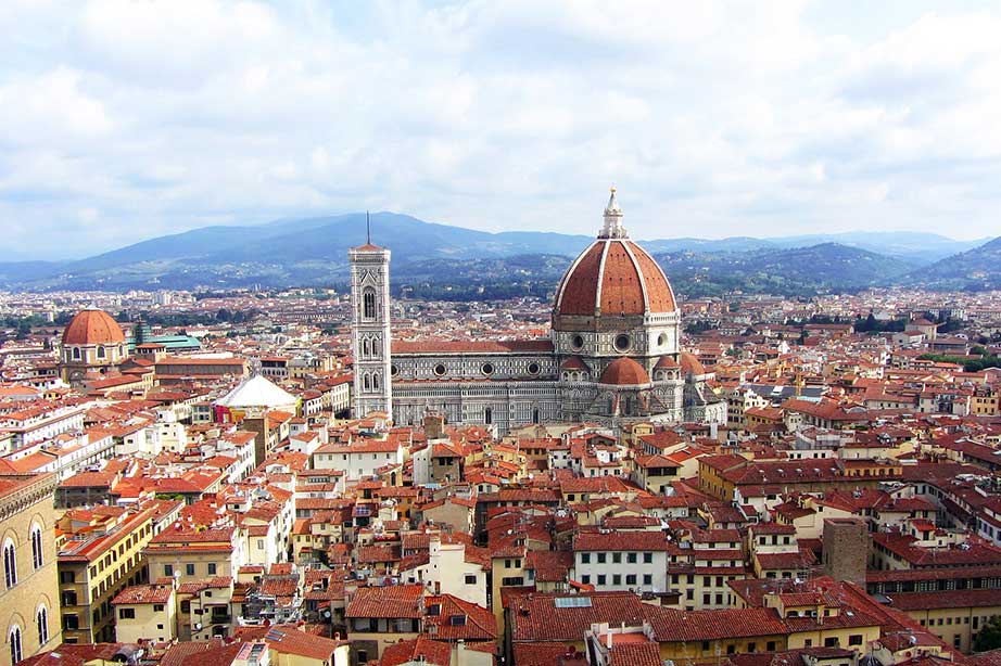view of the city of florence with kathedral and cloudy sky