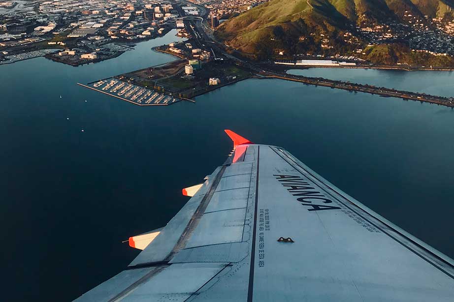 wing of avianca plane above water