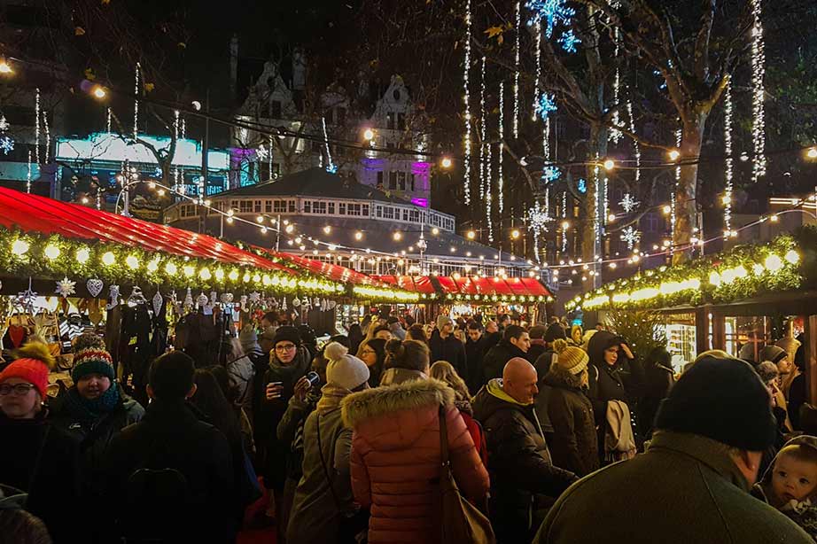 Christmas market at night with lights on