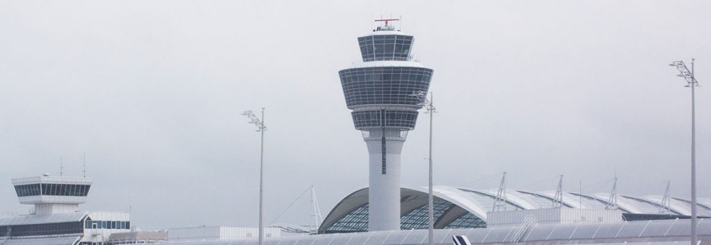 atc tower at the airport with grey sky