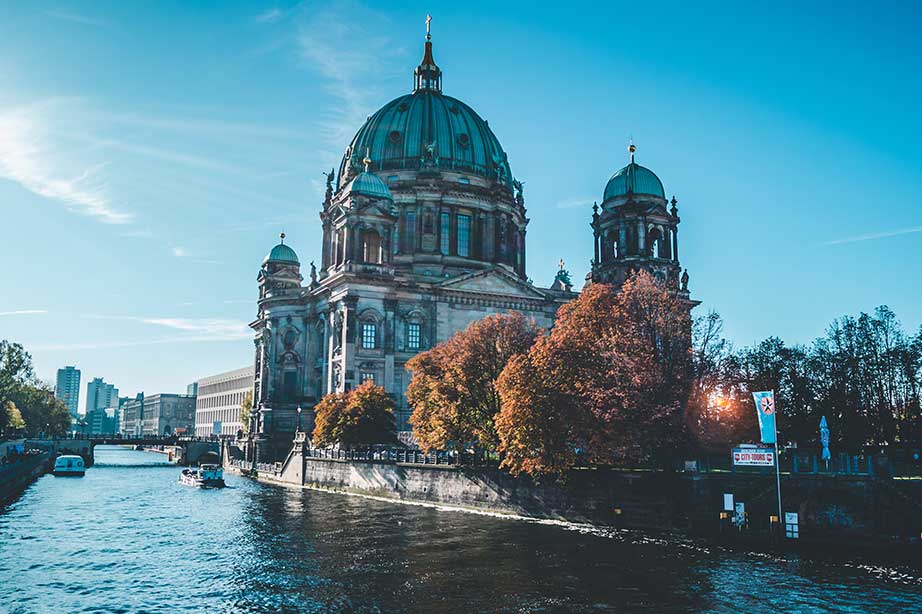 Berlin building along the spree under a blue sky