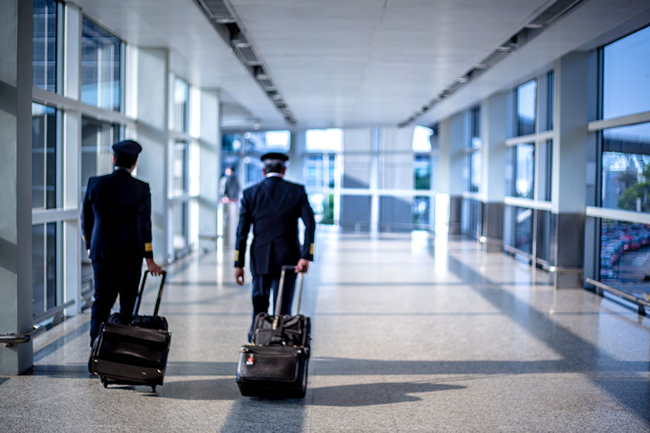 Two pilots walking through the airport