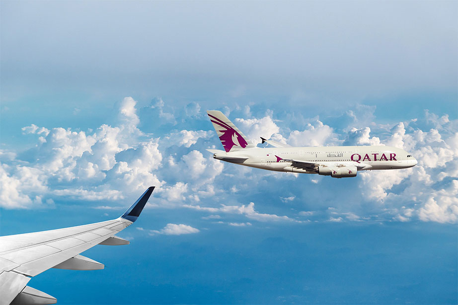 qatar airways plane in the sky