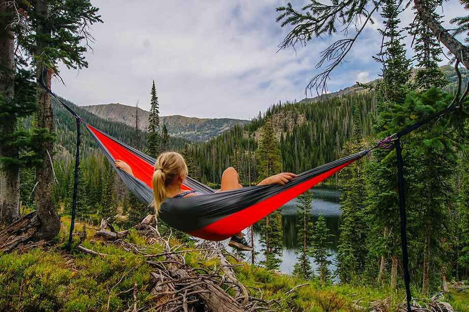 lady relaxing in hammock with beautiful view