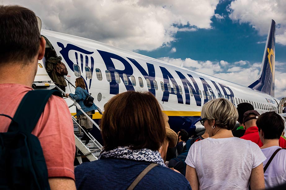 passengers boarding ryanair airplane