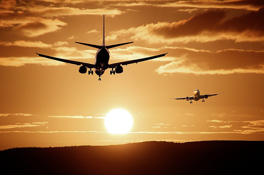 airplanes with setting sun