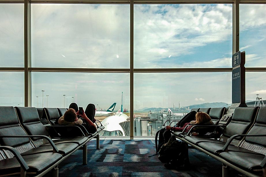 passengers waiting in gate for delayed flight